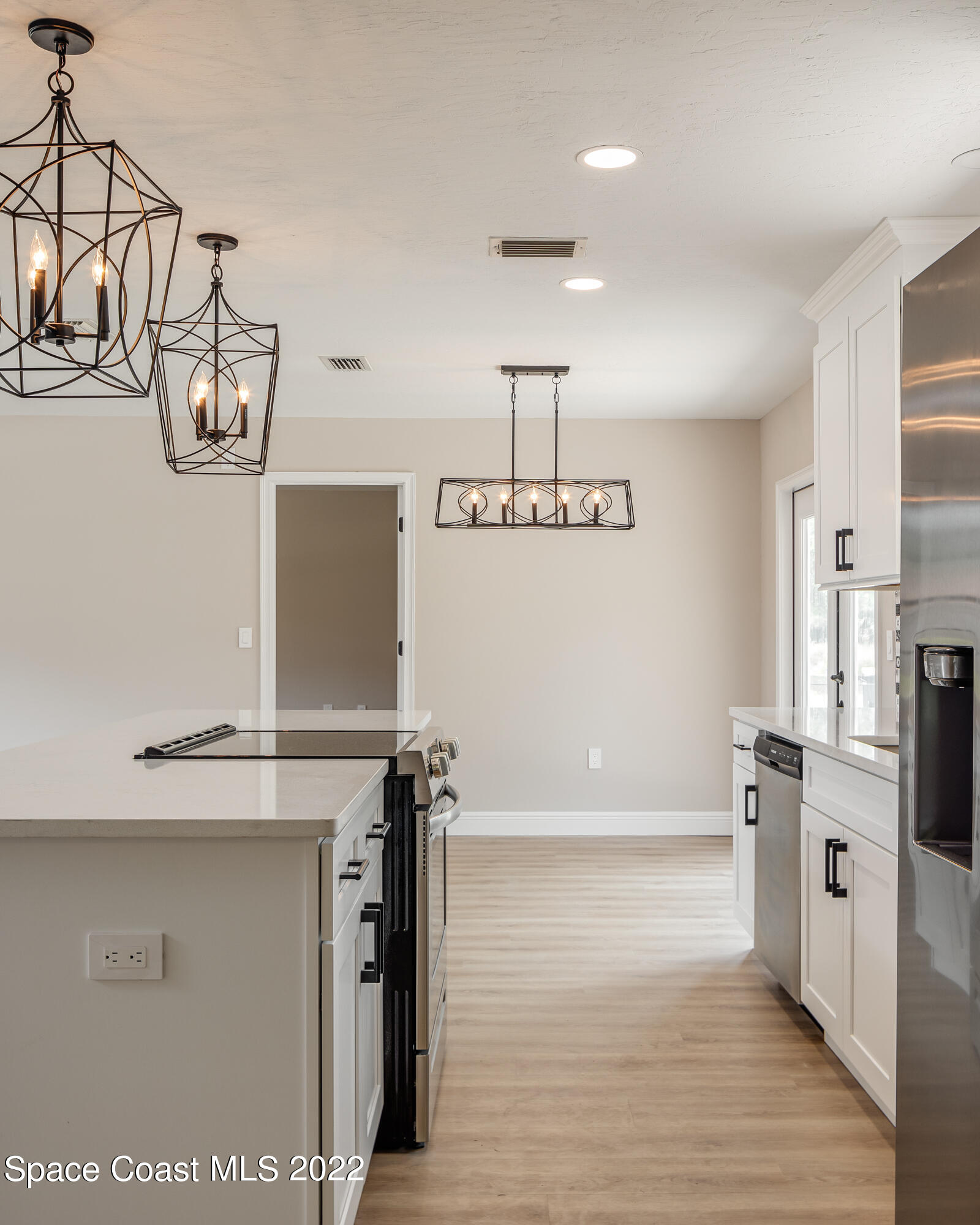 1011 Thompson Road Southwest Palm Bay, FL 32908 - Photo 5 of 17 a view of a kitchen with refrigerator and window