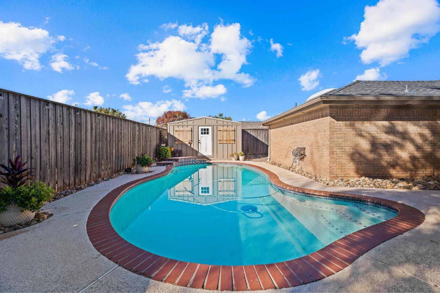 5409 88th Street Lubbock, TX 79424 - Photo 11 of 23 a view of a swimming pool with a patio