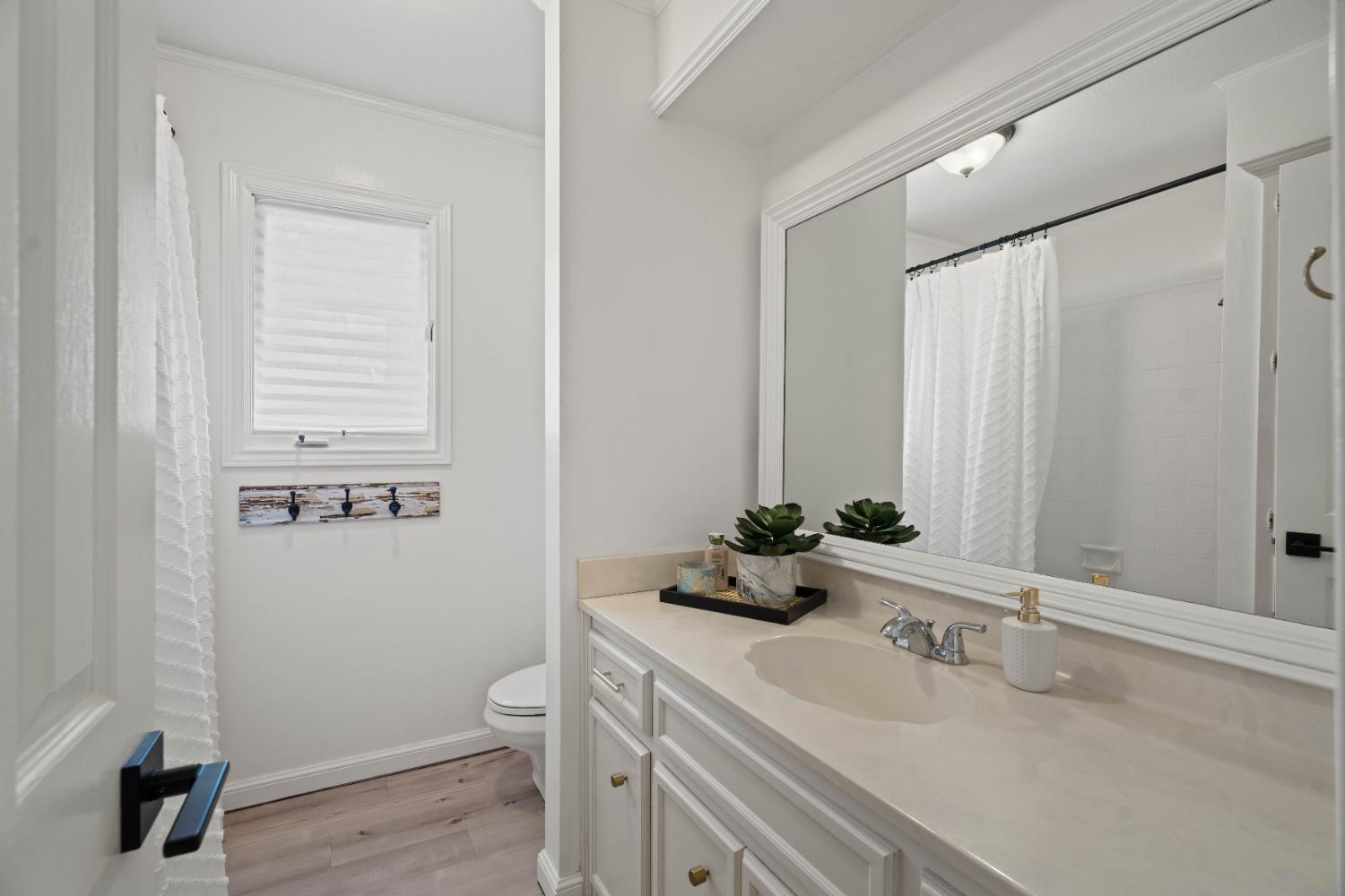 5409 88th Street Lubbock, TX 79424 - Photo 20 of 23 a bathroom with a sink toilet and vanity