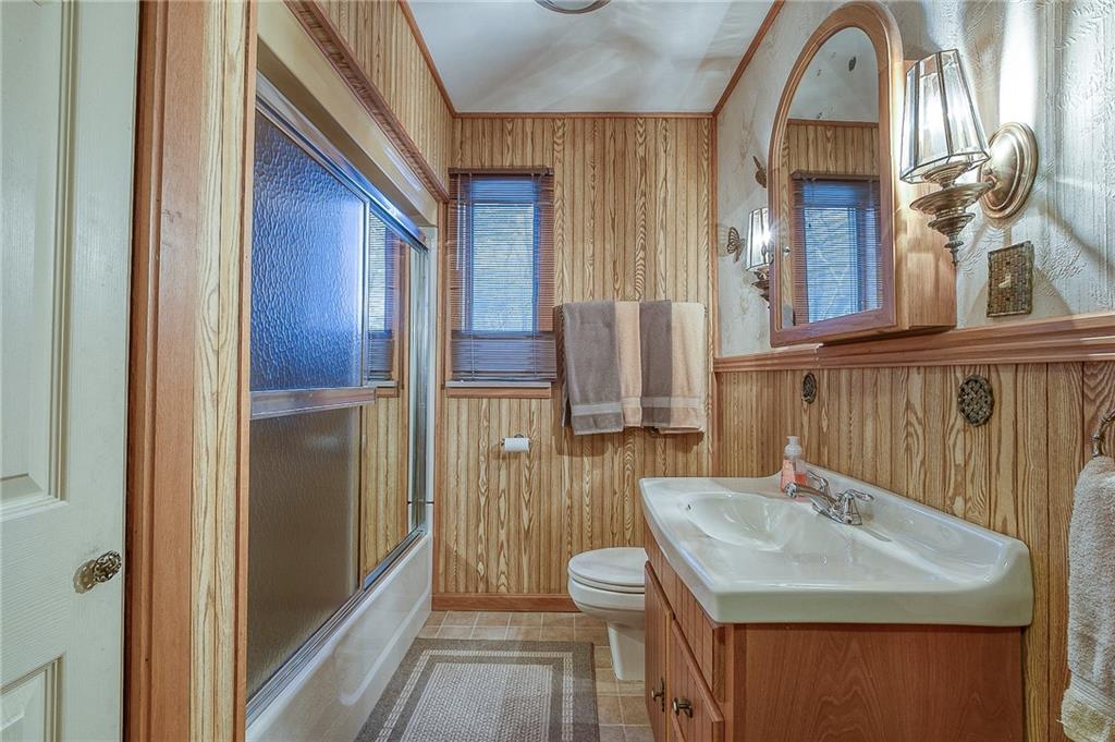 2618 New England Road West Mifflin, PA 15122 - Photo 12 of 25 a bathroom with a sink and a mirror