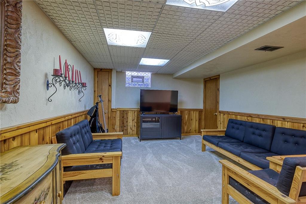 2618 New England Road West Mifflin, PA 15122 - Photo 16 of 25 a living room with furniture and a flat screen tv