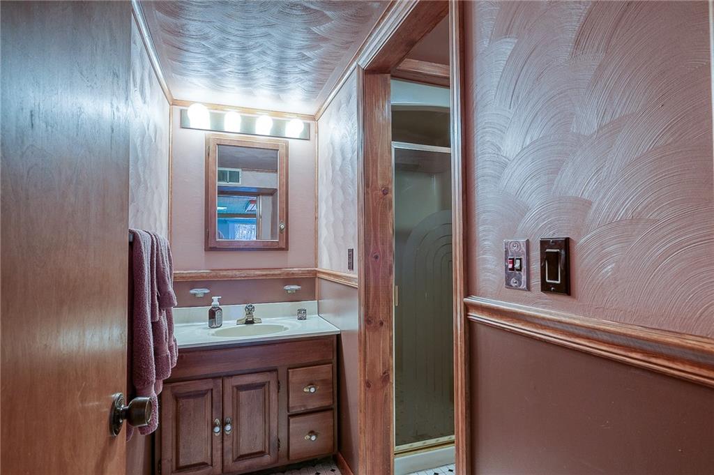 2618 New England Road West Mifflin, PA 15122 - Photo 18 of 25 a bathroom with a sink and a mirror