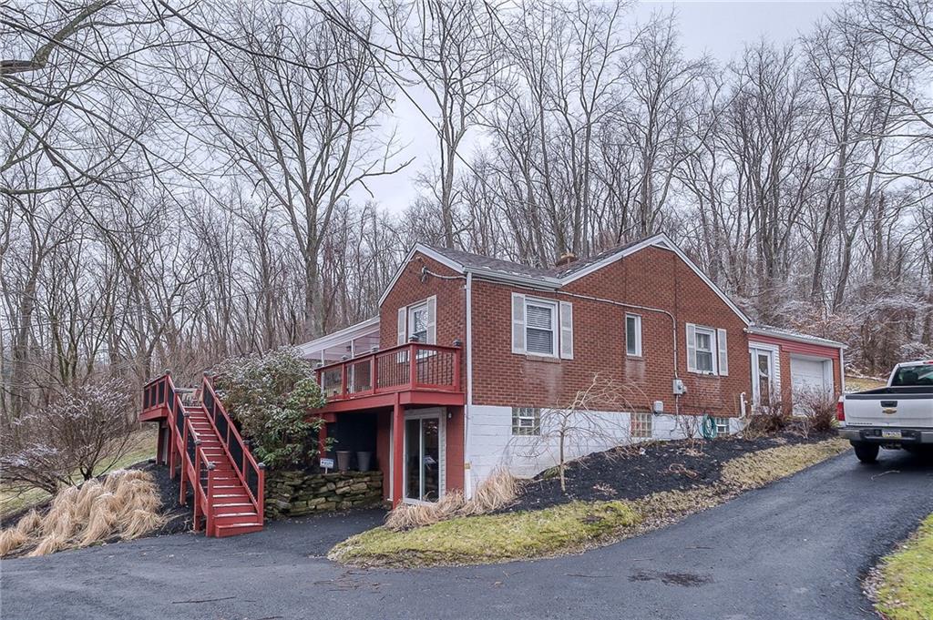 2618 New England Road West Mifflin, PA 15122 - Photo 2 of 25 a front view of a house with a yard