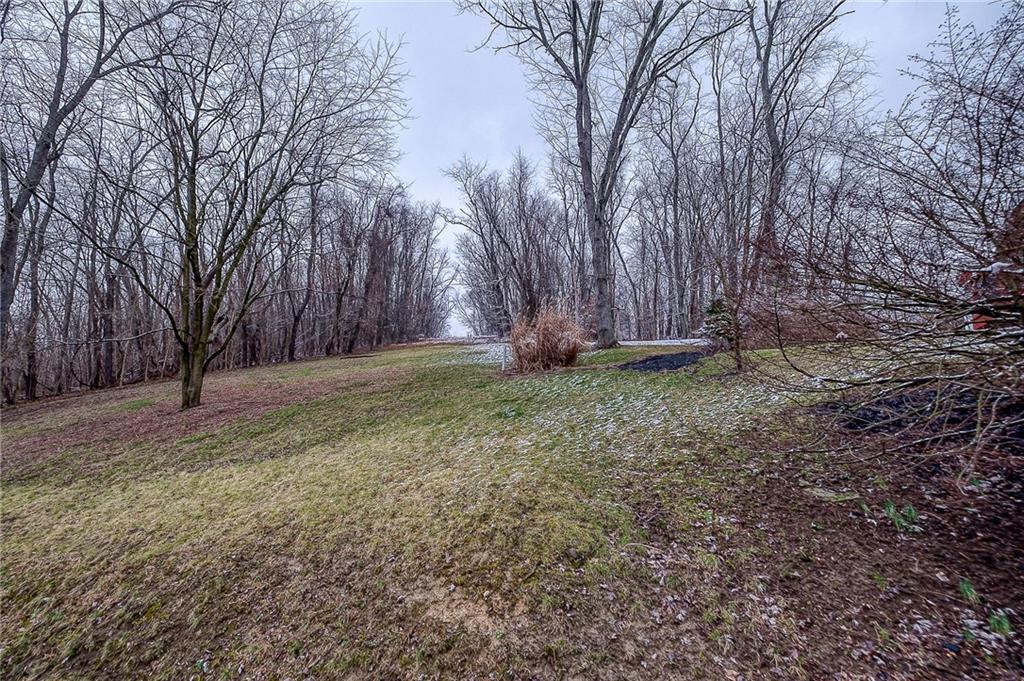 2618 New England Road West Mifflin, PA 15122 - Photo 22 of 25 a backyard of a house with lots of green space