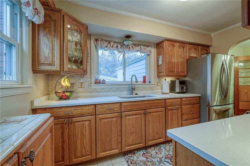 2618 New England Road West Mifflin, PA 15122 - Photo 6 of 25 a kitchen with granite countertop a sink stainless steel appliances and cabinets