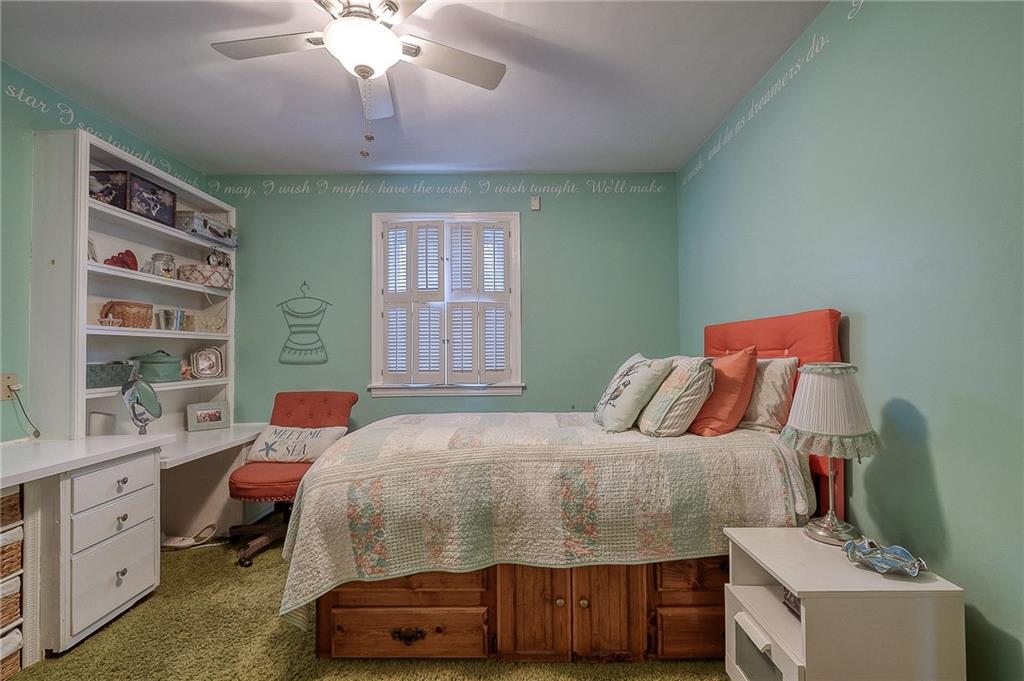 2618 New England Road West Mifflin, PA 15122 - Photo 10 of 25 a bedroom with a bed and a chandelier