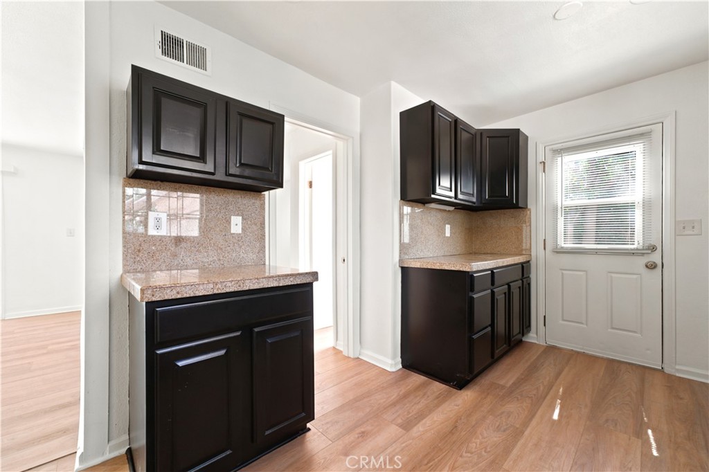 1720 Anderson Street Simi Valley, CA 93065 - Photo 4 of 30 a kitchen with stainless steel appliances granite countertop a stove microwave and sink