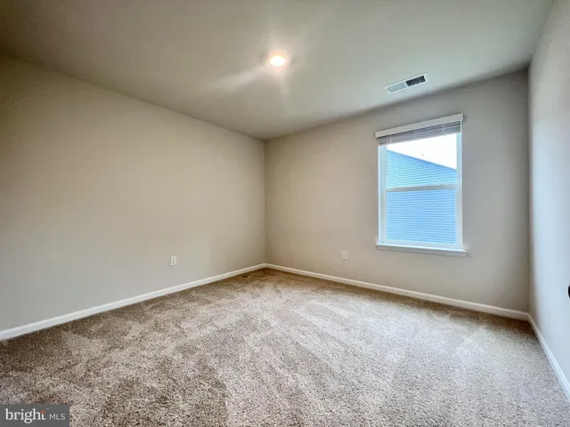 a view of an empty room and closet