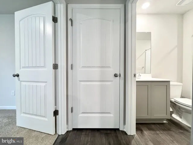 a view of a bathroom with wooden floor