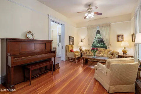 a living room with furniture a fireplace and a window