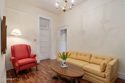 a living room with furniture a couch and a chandelier