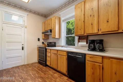 a bathroom with a sink a toilet and shower curtain