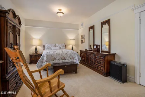 a bedroom with furniture and a bed