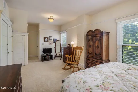a bathroom with a granite countertop toilet sink and a mirror