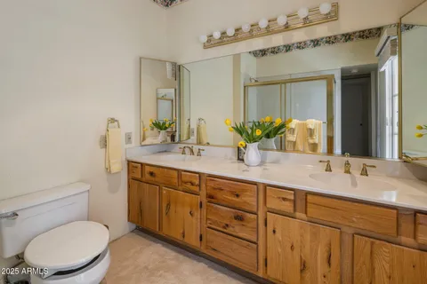 a bathroom with a shower and toilet