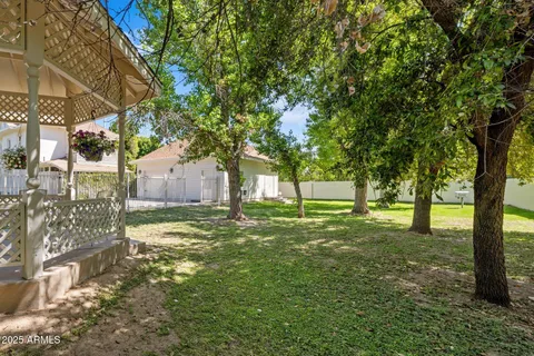 a bedroom that has a bed and a table in it