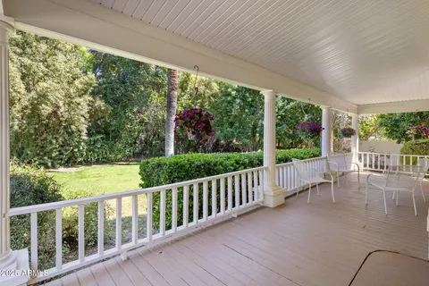 a view of a wooden deck next to a yard