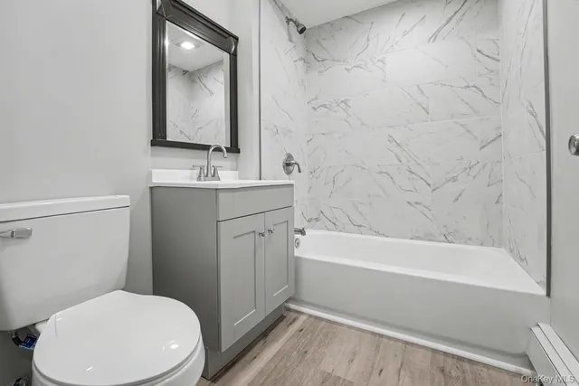 a bathroom with a sink a toilet and bathtub