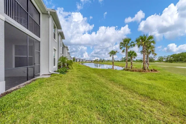 a front view of a house with a yard and street view