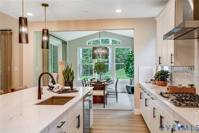 a kitchen with sink a counter and cabinets