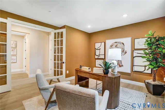 a living room with furniture potted plant and a window