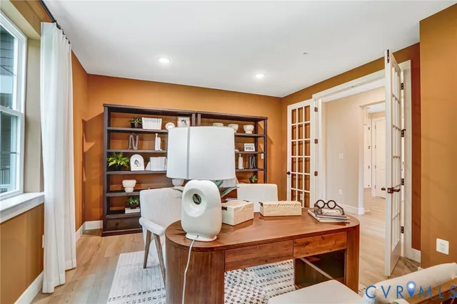 a view of a dining room with a table and chairs