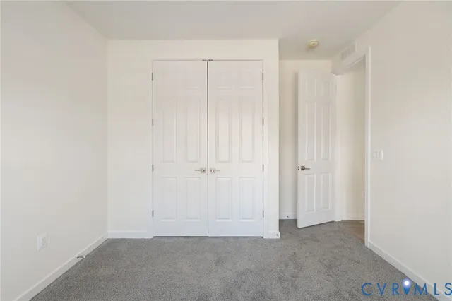 a spacious bathroom with a granite countertop sink mirror and double