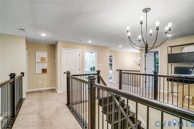 a view of a hallway with a chandelier