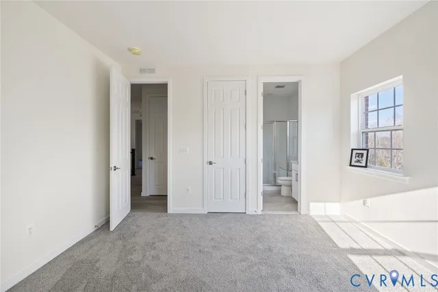 a bathroom with a sink toilet vanity and shower