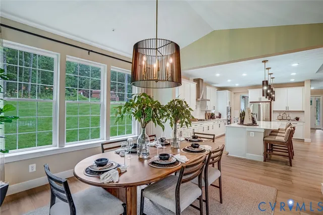 a view of a dining room with furniture window and outside view