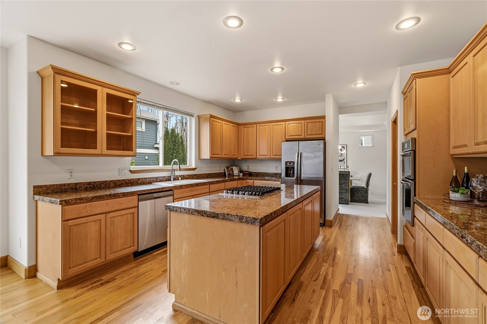 18639 175th Avenue Southeast Renton, WA 98058 - Photo 11 of 37 a kitchen with stainless steel appliances granite countertop a stove and a sink