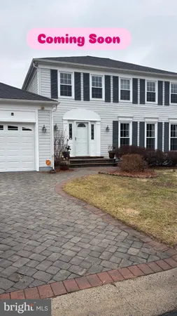 a front view of residential houses with yard