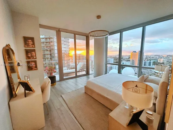 a hallway with a large window and a rug