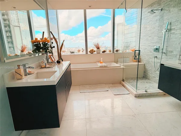 a room with a large window and a table