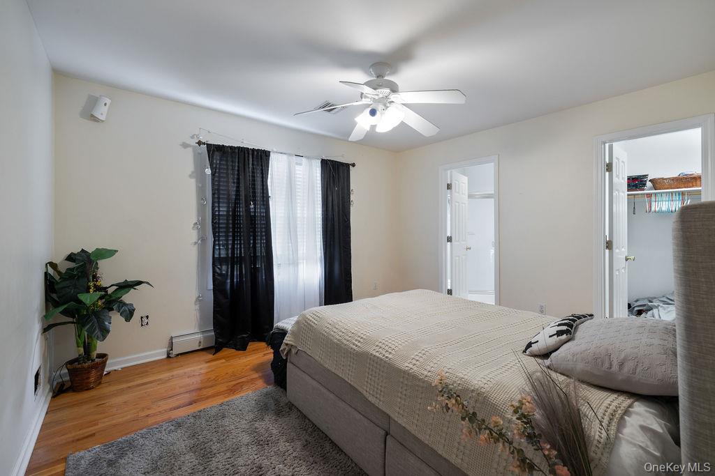 30 Chestnut Street Stony Point, NY 10980 - Photo 17 of 34 a bedroom with a bed and a chandelier