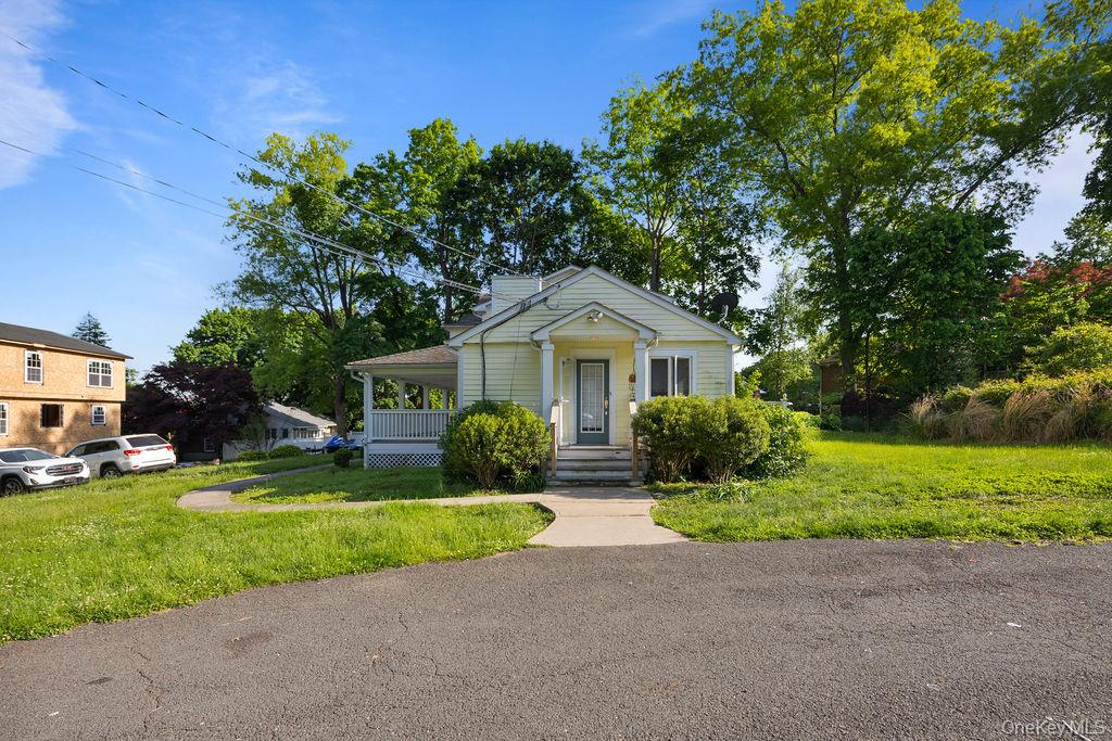 30 Chestnut Street Stony Point, NY 10980 - Photo 22 of 34 a front view of a house with a yard and garage