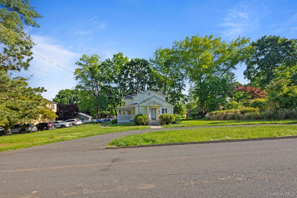 30 Chestnut Street Stony Point, NY 10980 - Photo 23 of 34 a front view of a house with a yard and trees