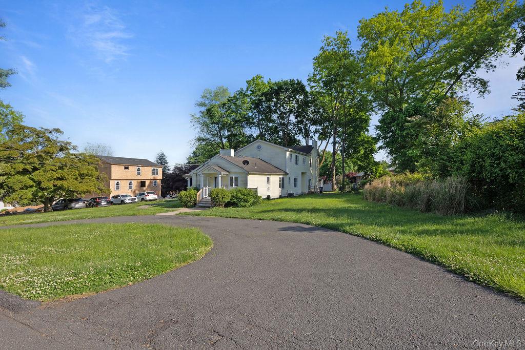 30 Chestnut Street Stony Point, NY 10980 - Photo 26 of 34 a front view of a house with a yard and garage