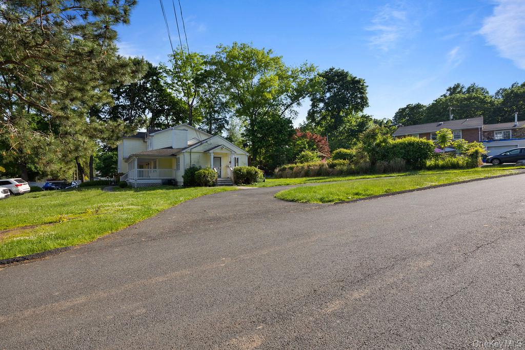 30 Chestnut Street Stony Point, NY 10980 - Photo 27 of 34 a front view of a house with a yard and garage