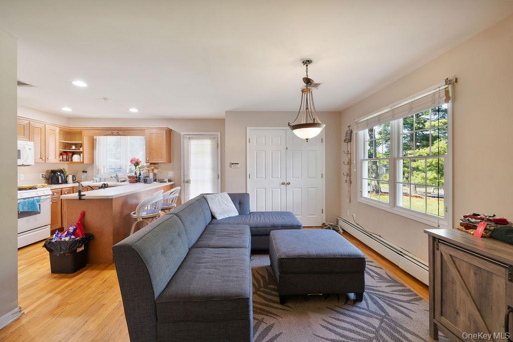 30 Chestnut Street Stony Point, NY 10980 - Photo 9 of 34 a living room with furniture and a chandelier