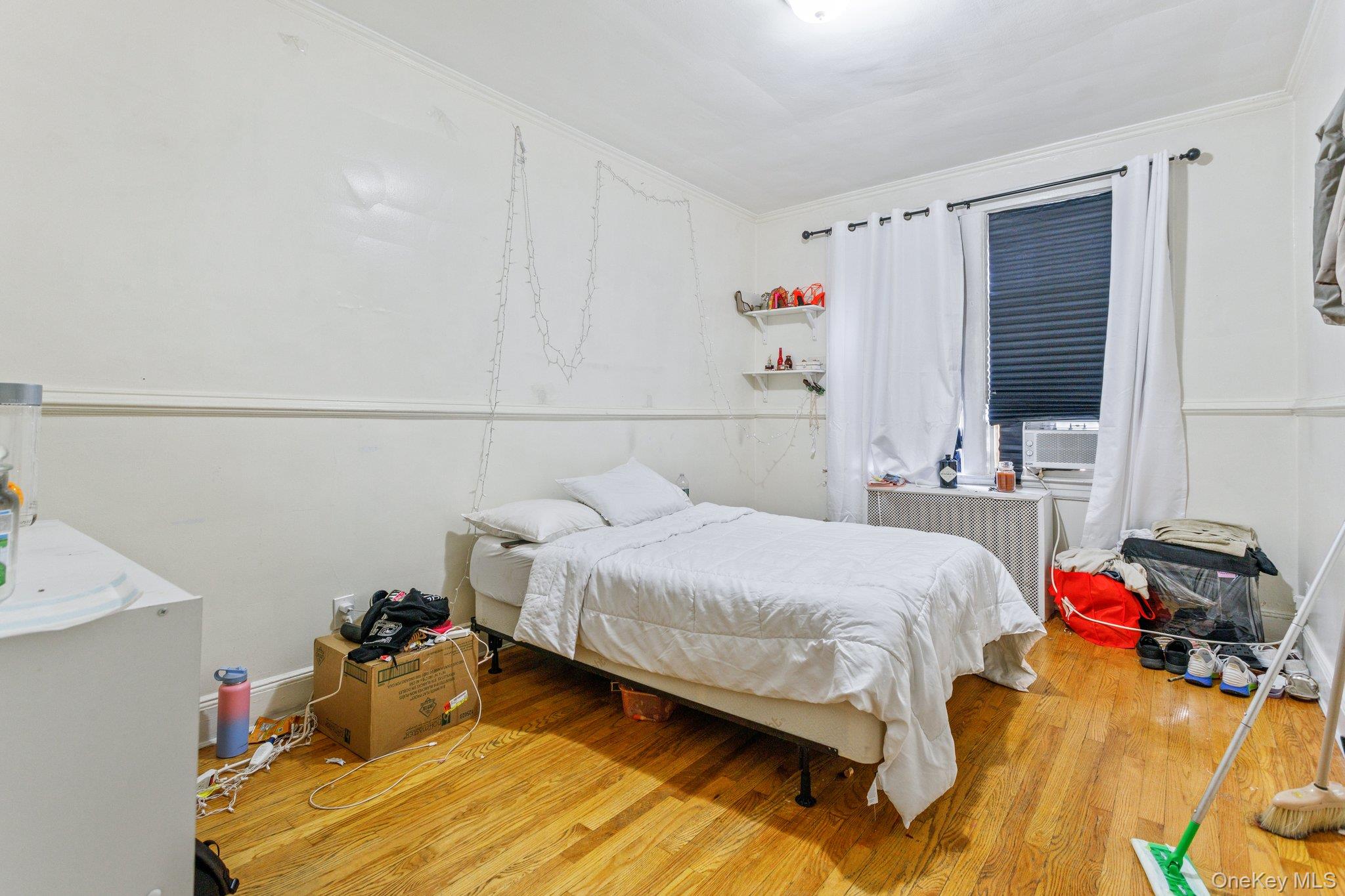 34-29 58th Street Queens, NY 11377 - Photo 5 of 23 a bedroom with a bed and a closet