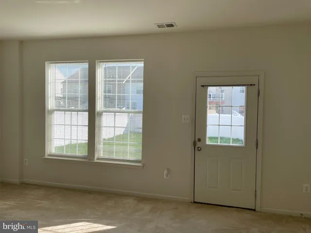 a view of a building with a yard