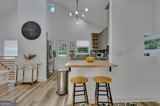 a view of a dining room with furniture and window