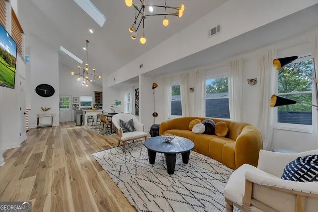 a bed room with a bed mirror and a table