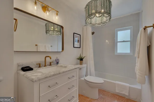 a bedroom with bed and window