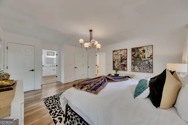 a view of a livingroom with furniture and a floor to ceiling window
