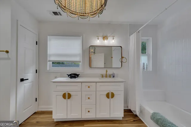 a view of workspace with wooden floor stairs and windows