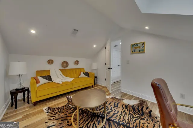 a living room with a couch and a rug