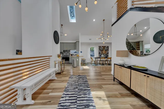 a kitchen with stainless steel appliances granite countertop a sink and a stove