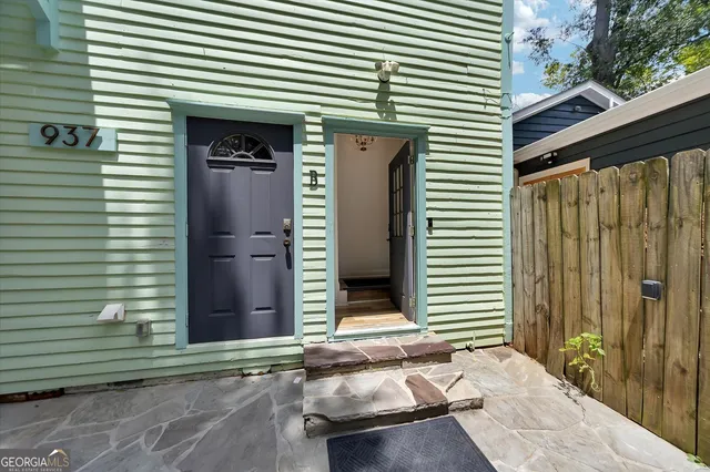 a view of a livingroom with furniture and a window
